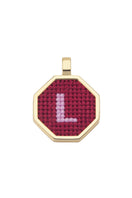 Red personalized letter pendant necklace by Maria Frering, featuring a custom engraved initial on a sleek chain.