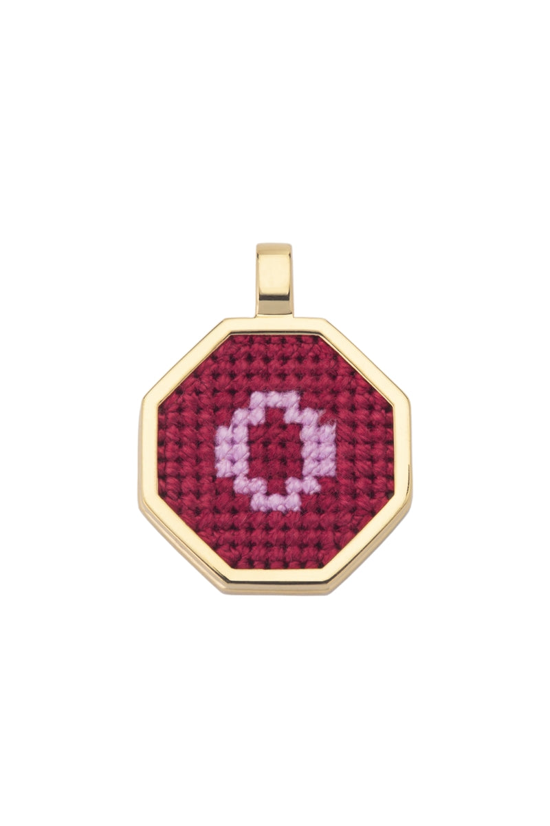 Personalised letter pendant necklace by Maria Frering featuring a red pendant with customizable initial.
