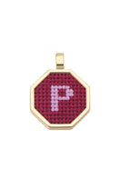 Red personalized letter pendant necklace by Maria Frering featuring a custom initial on a sleek chain.