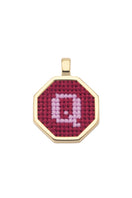 Personalised letter pendant necklace by Maria Frering featuring a red pendant with custom initial design.