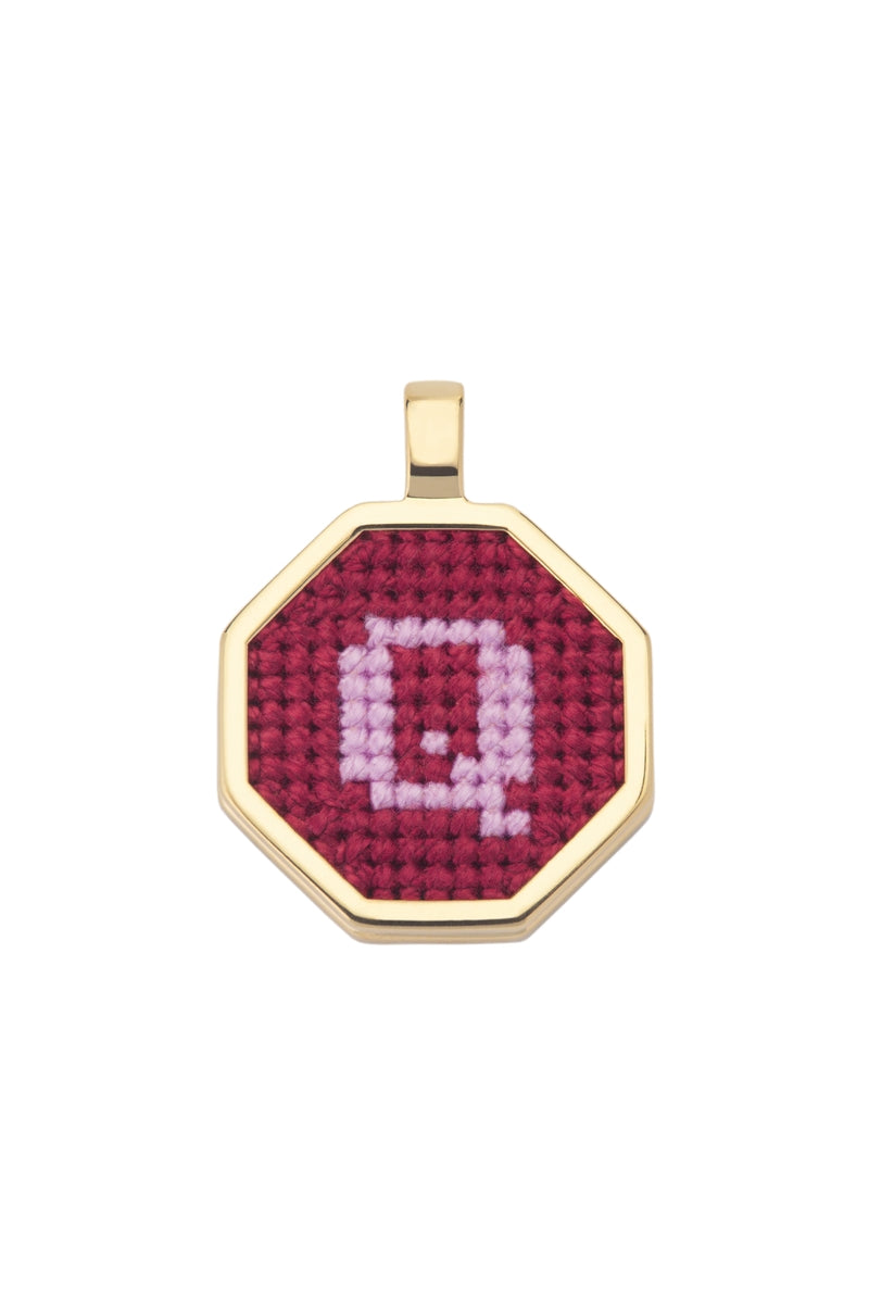Personalised letter pendant necklace by Maria Frering featuring a red pendant with custom initial design.
