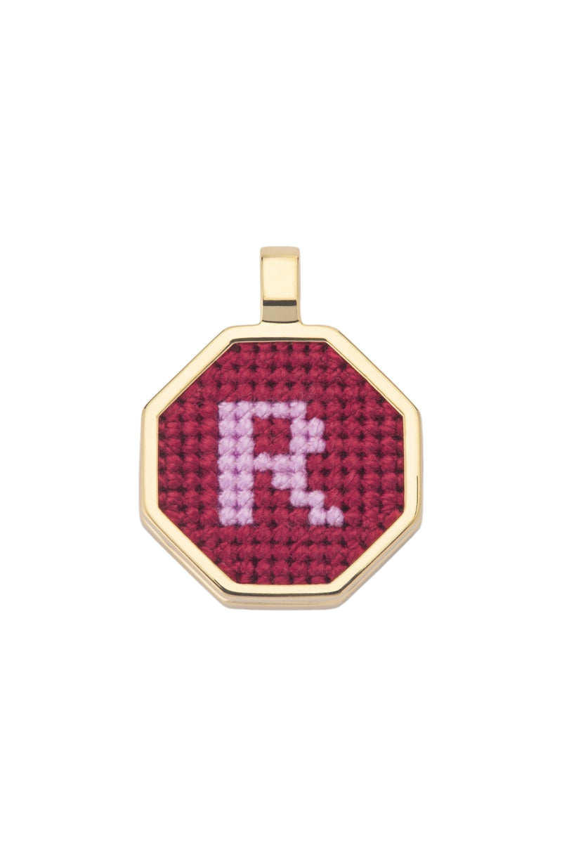 Red personalized letter pendant necklace by Maria Frering featuring a custom initial in elegant design.