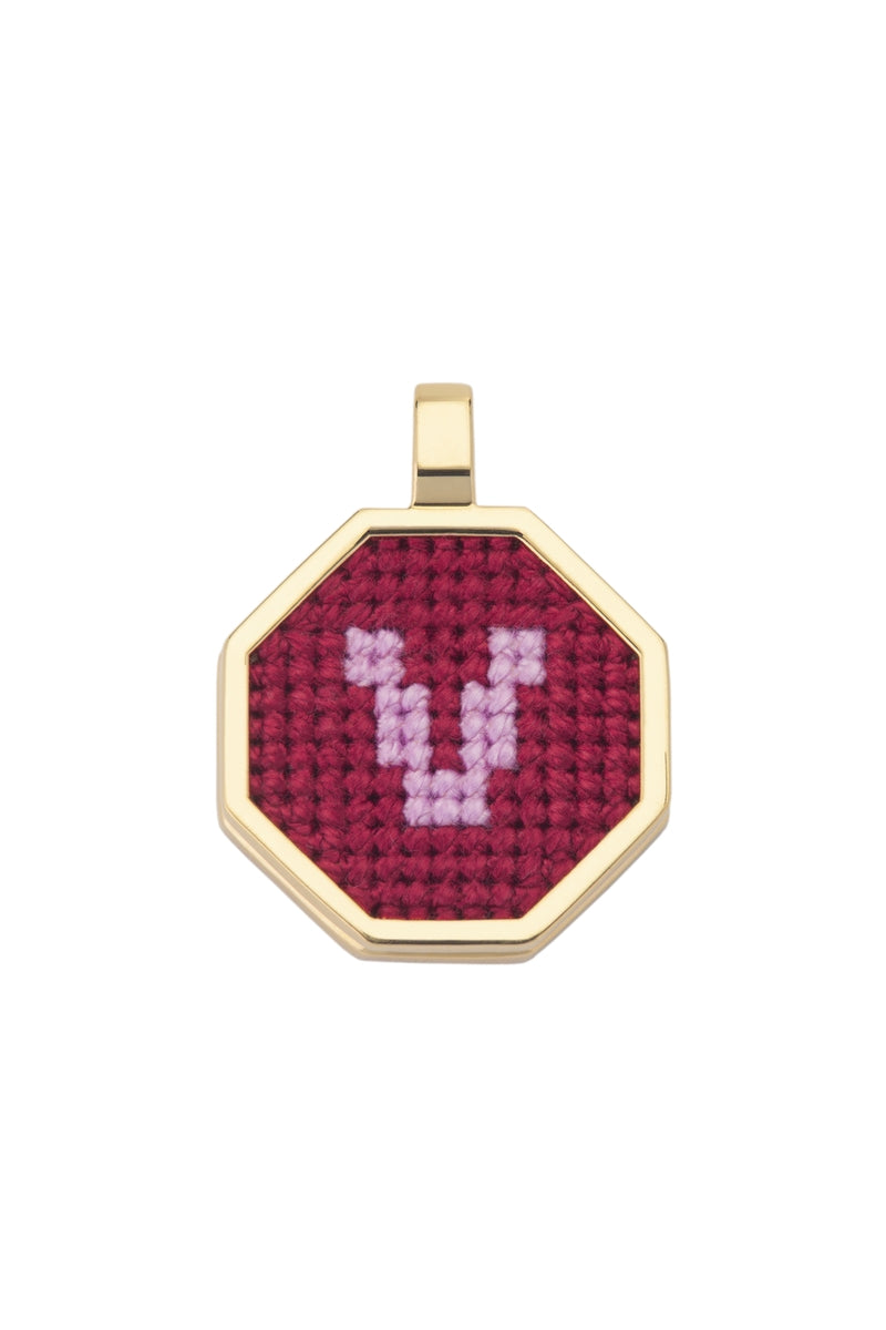 Red personalized letter pendant necklace by Maria Frering, featuring a custom initial charm on a delicate chain.