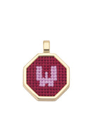 Red personalized letter pendant necklace by Maria Frering featuring custom initial charm on a delicate chain.