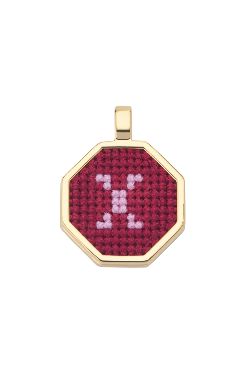 Personalised letter pendant necklace by Maria Frering featuring a red letter charm on a delicate chain.