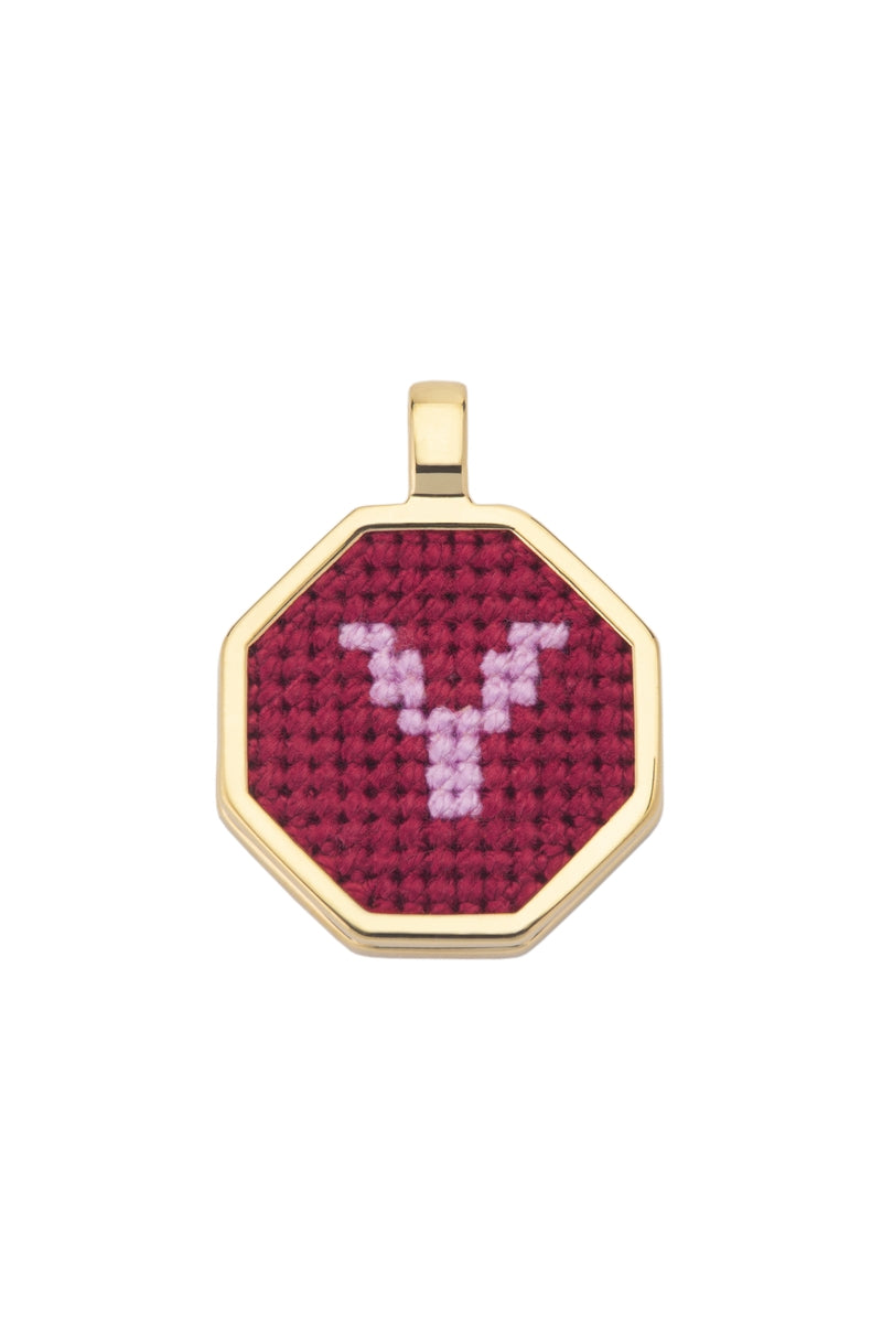 Red personalized letter pendant necklace by Maria Frering featuring a custom initial charm on a delicate chain.