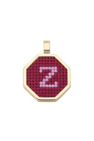 Red personalized letter pendant necklace by Maria Frering, featuring a custom engraved letter on a delicate chain.