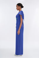 Tiny Ink Petal's Secret Dance asymmetrical cape evening gown featuring flowing fabric and elegant design, displayed on a model.