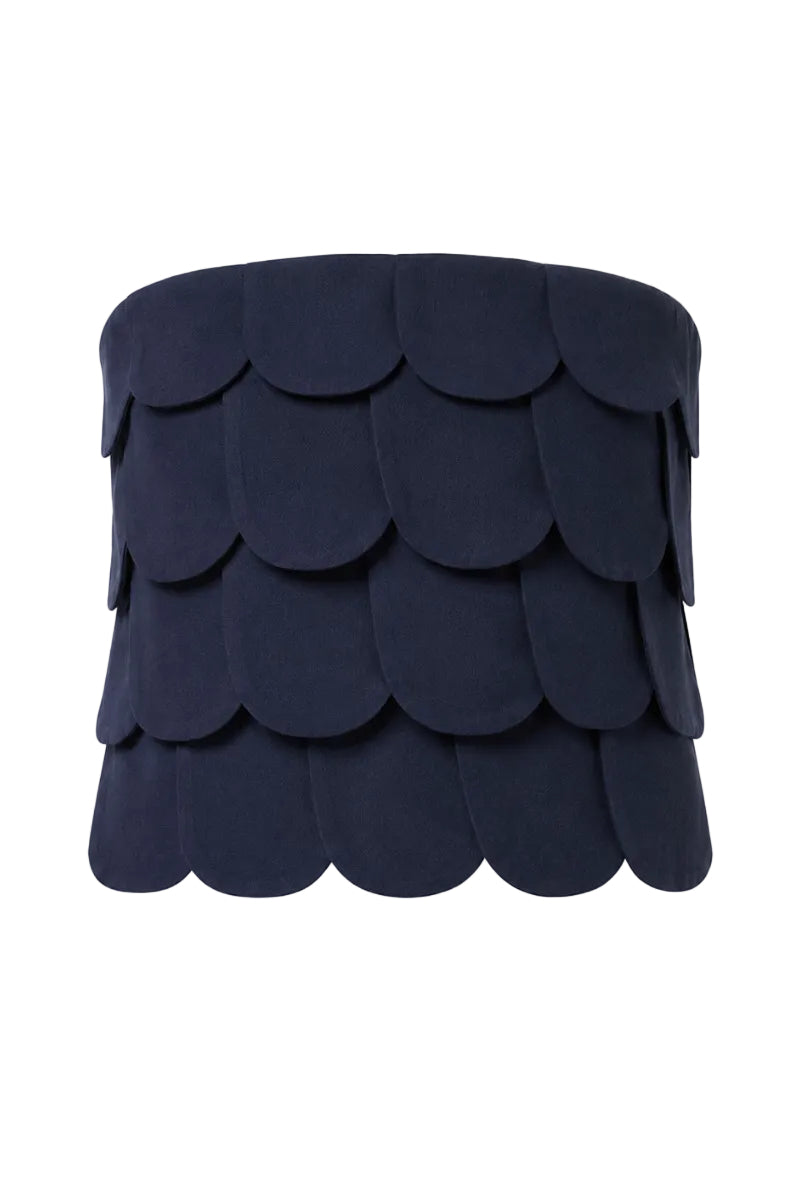 Navy blue Petalia crop top from ANA + MARIA displayed on a ghost mannequin, showcasing its fitted sleeveless design.