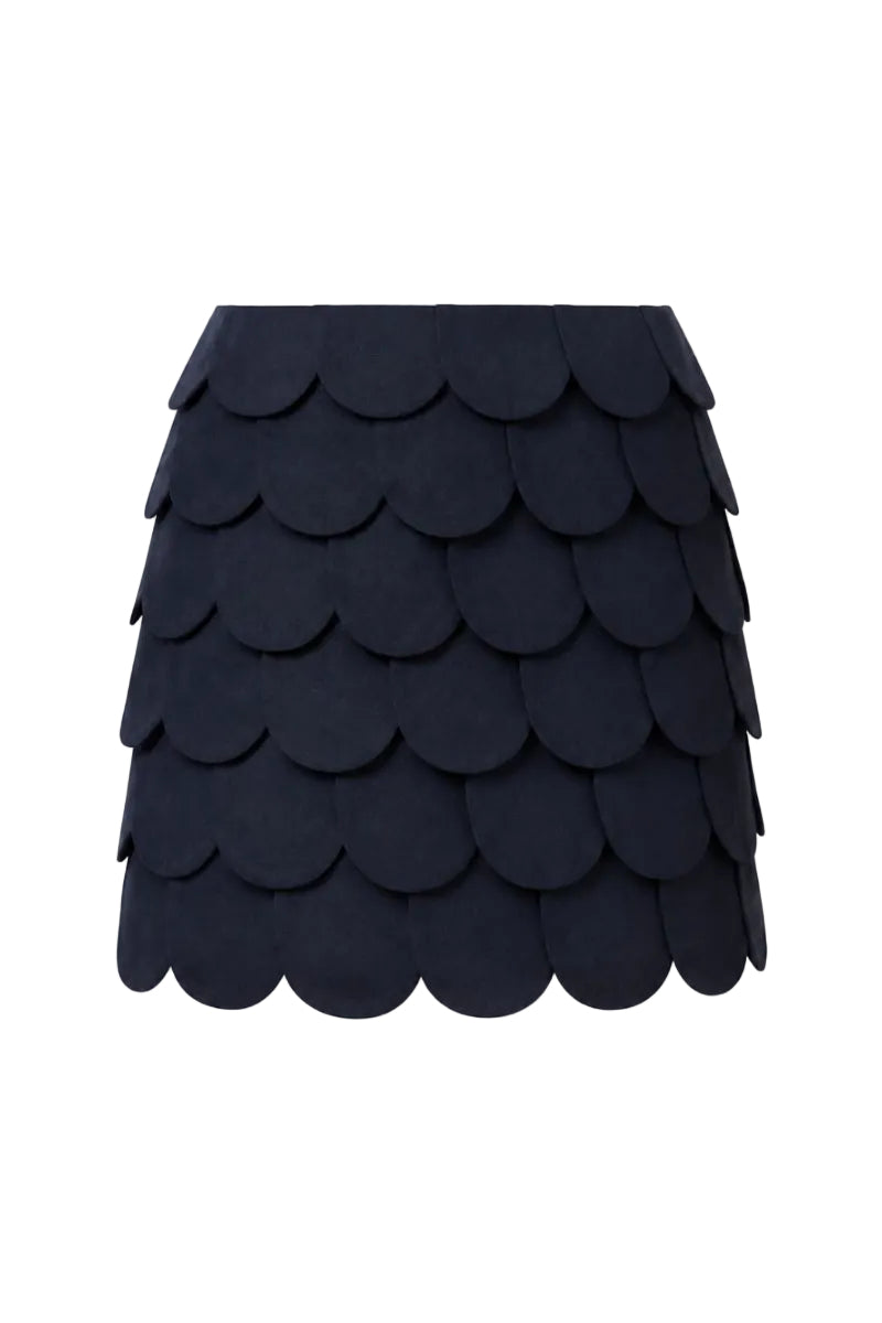Navy blue Petalia mini skirt by Ana + Maria displayed on a ghost mannequin, showcasing the fitted style and fabric texture.