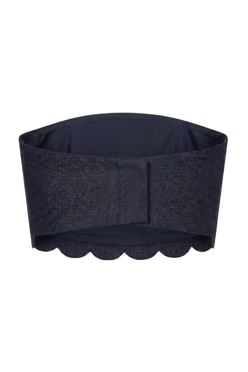 Navy blue Petalia crop top by ANA + MARIA displayed on a ghost mannequin, showcasing its fitted style and soft fabric.