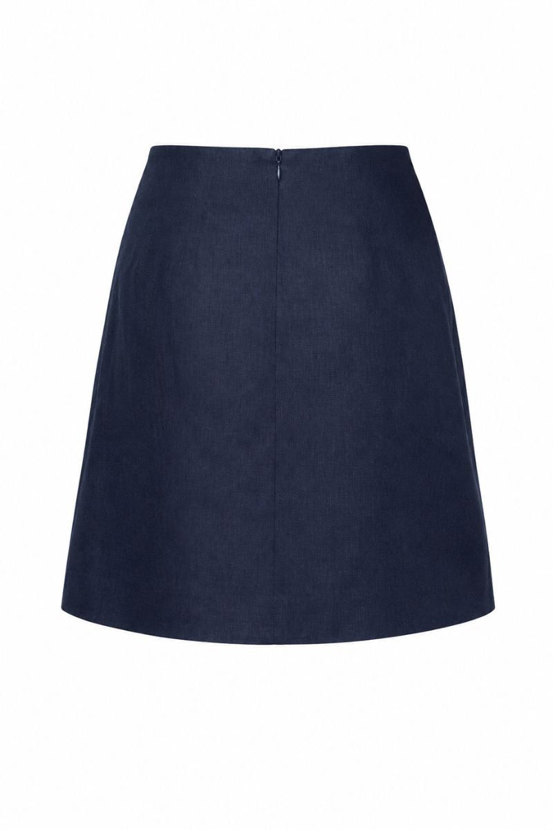 Navy blue Petalia mini skirt by ANA + MARIA displayed on a ghost mannequin, showcasing its fitted style and clean design.