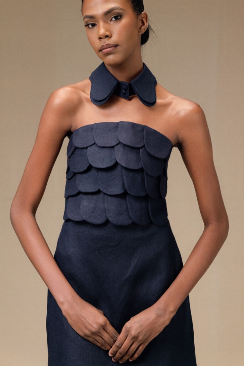 Navy blue Petalia crop top by ANA + MARIA, featuring a fitted style with short sleeves and a round neckline.
