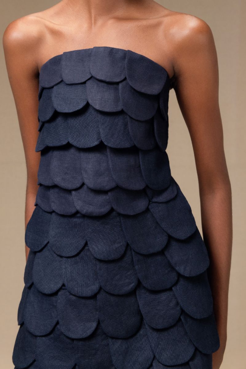 Navy blue Petalia crop top by ANA + MARIA, featuring a fitted design and cropped length, displayed on a neutral background.