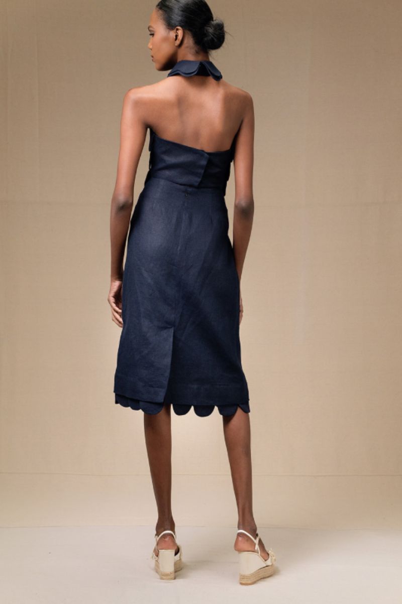 Navy blue Petalia crop top by ANA + MARIA, shown on a model with short sleeves and a fitted design.