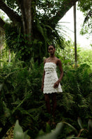Petalia ivory mini skirt by ANA + MARIA displayed on a model in a fashion campaign photo.