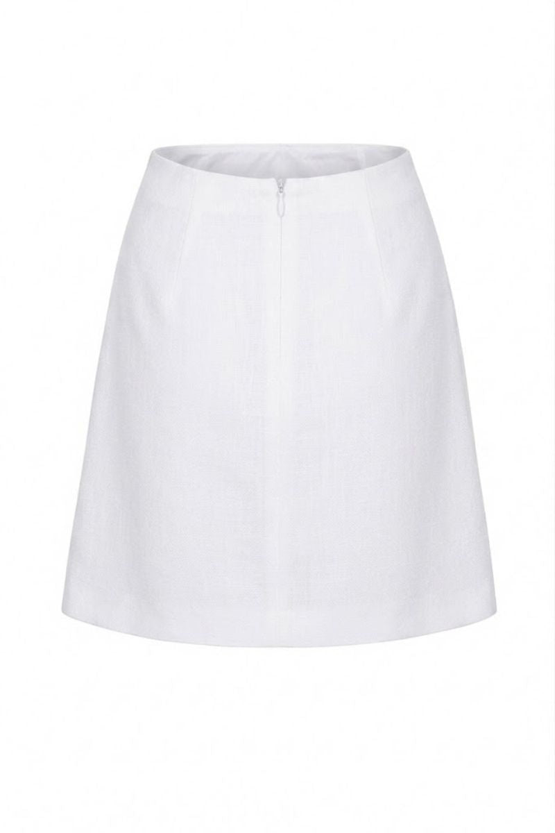 Ivory Petalia mini skirt by ANA + MARIA displayed on a ghost mannequin, showcasing the fitted waist and stylish length.