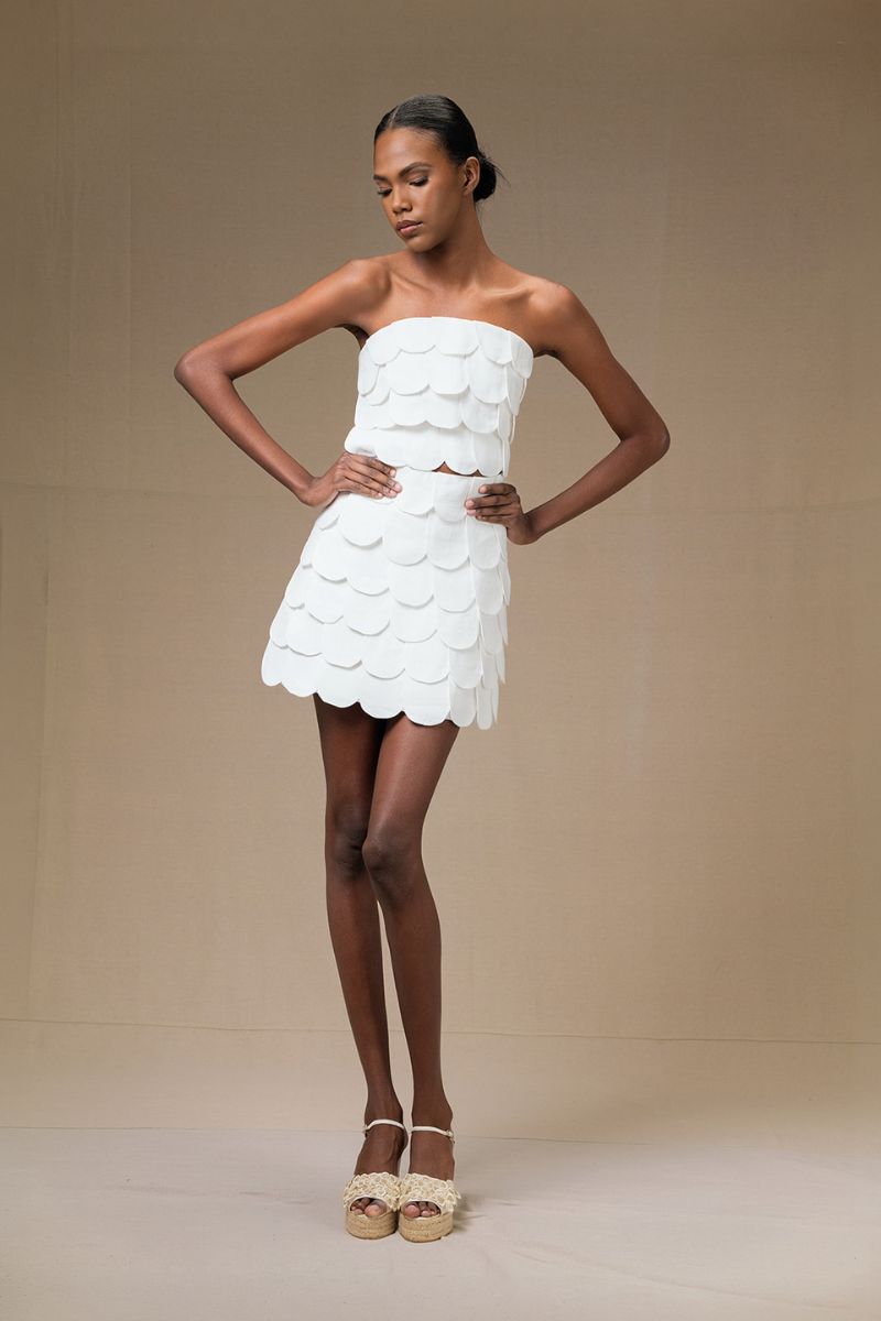 Ivory Petalia mini skirt by Ana + Maria shown on a model, featuring a stylish and lightweight design ideal for casual wear.