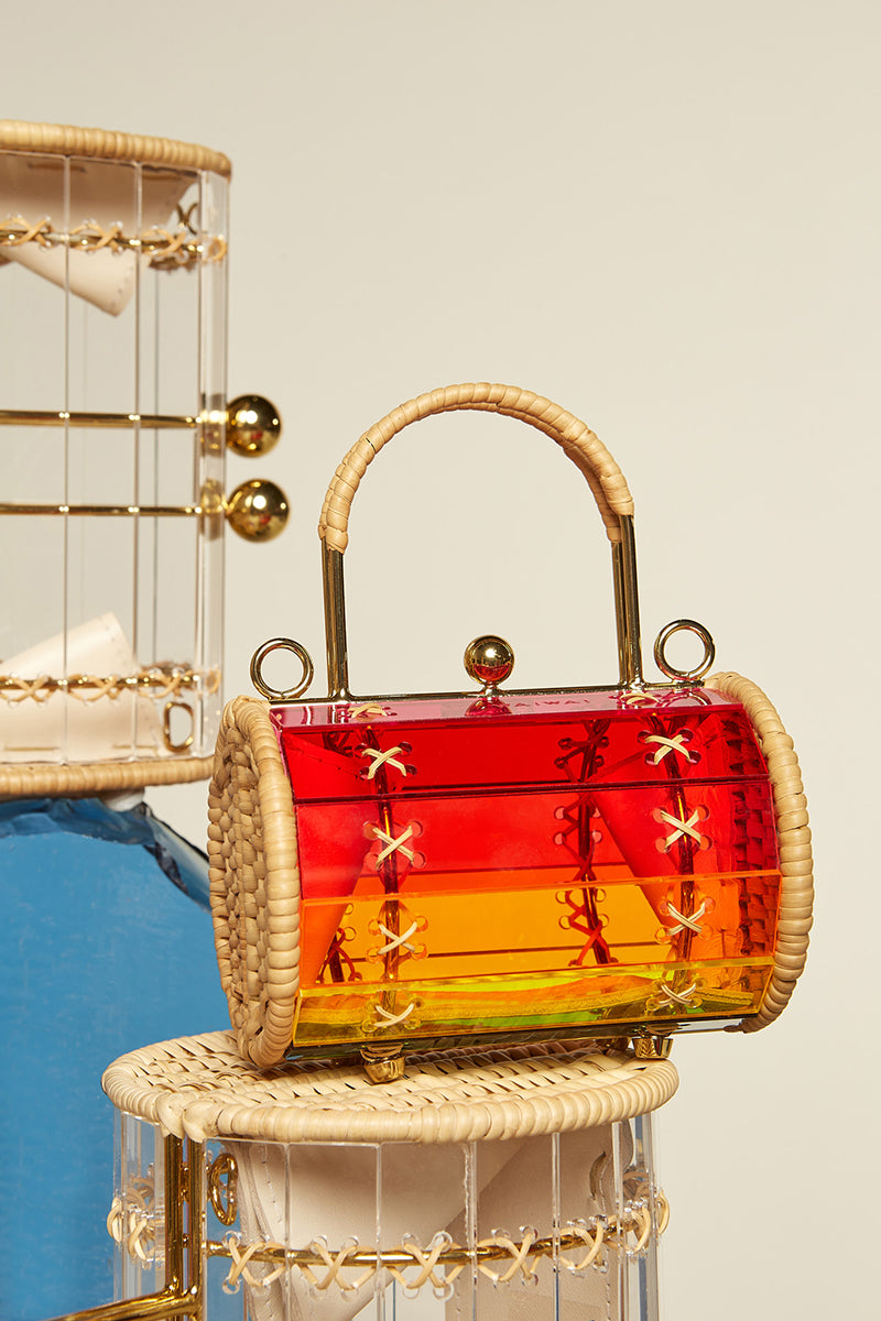 Waiwai Rio Petit Alix top handle bag in multi-color design, featuring a sleek, structured shape with top handles and elegant details.