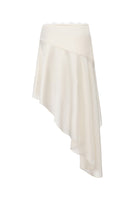 Nana Jacqueline Petra midi skirt in champagne with an asymmetric hem, shown from the back. Elegant and stylish fashion piece.
