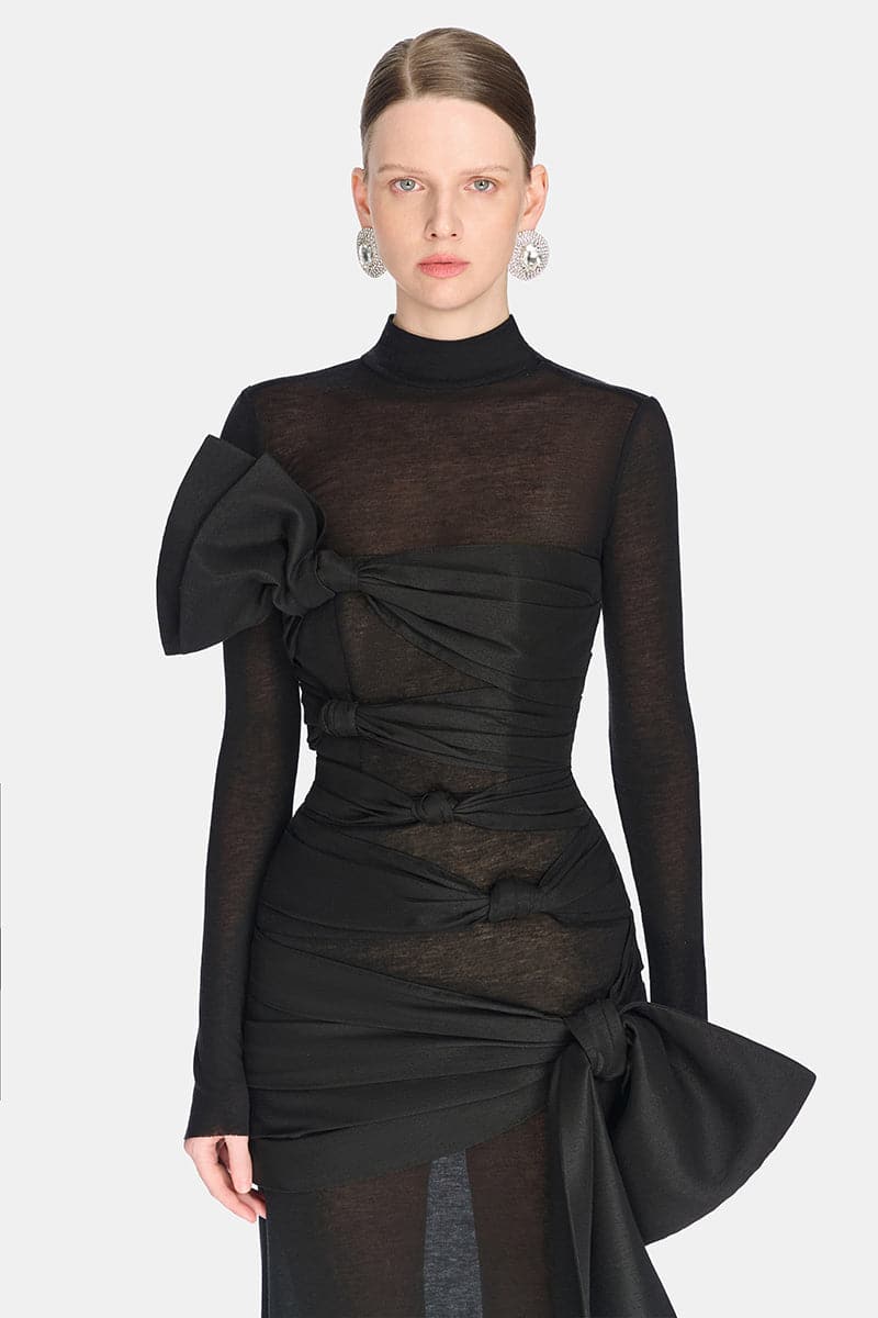 Close-up of Montsand Phenomena gown showing intricate fabric details and elegant design in a high-quality fashion photograph.