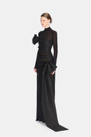 Montsand Phenomena dress gown shown from the side, featuring elegant fabric and flowing silhouette.
