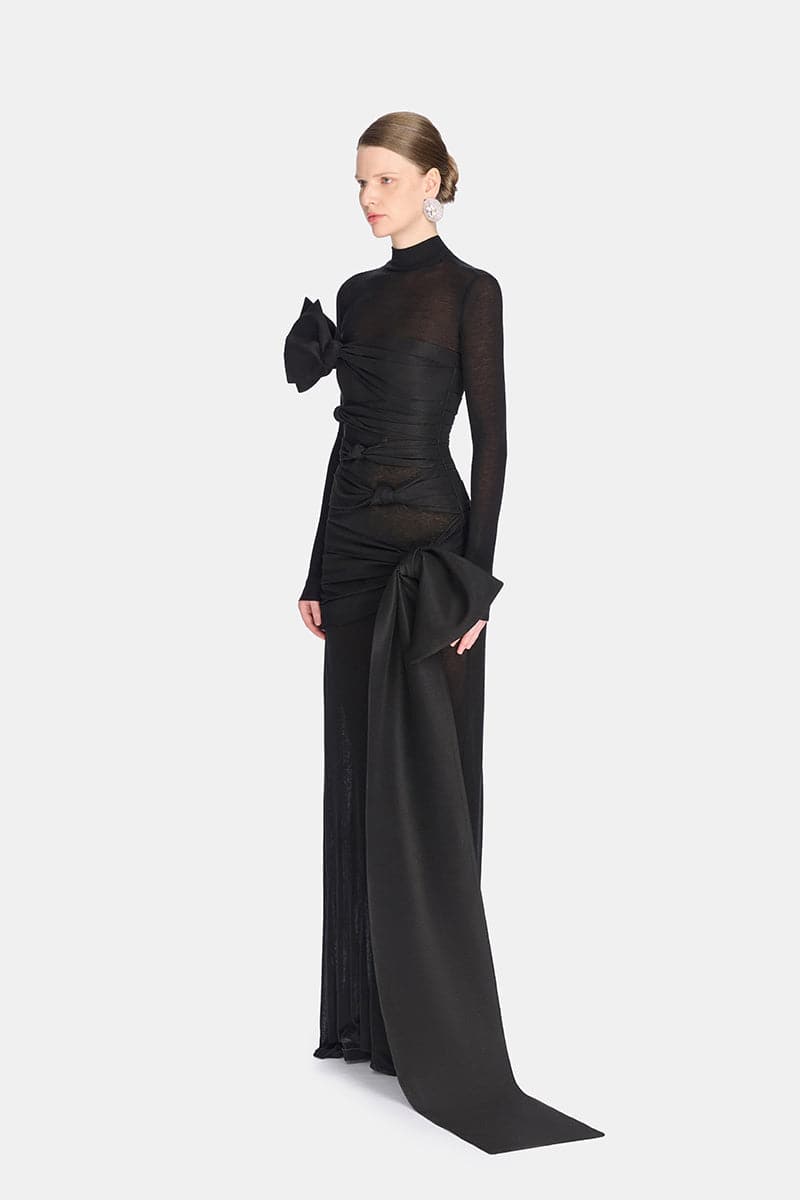 Montsand Phenomena dress gown shown from the side, featuring elegant fabric and flowing silhouette.
