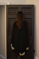 Nadya Shah Phoebe cape jacket in soft fabric, shown from the back with a flowing design and stylish drape.