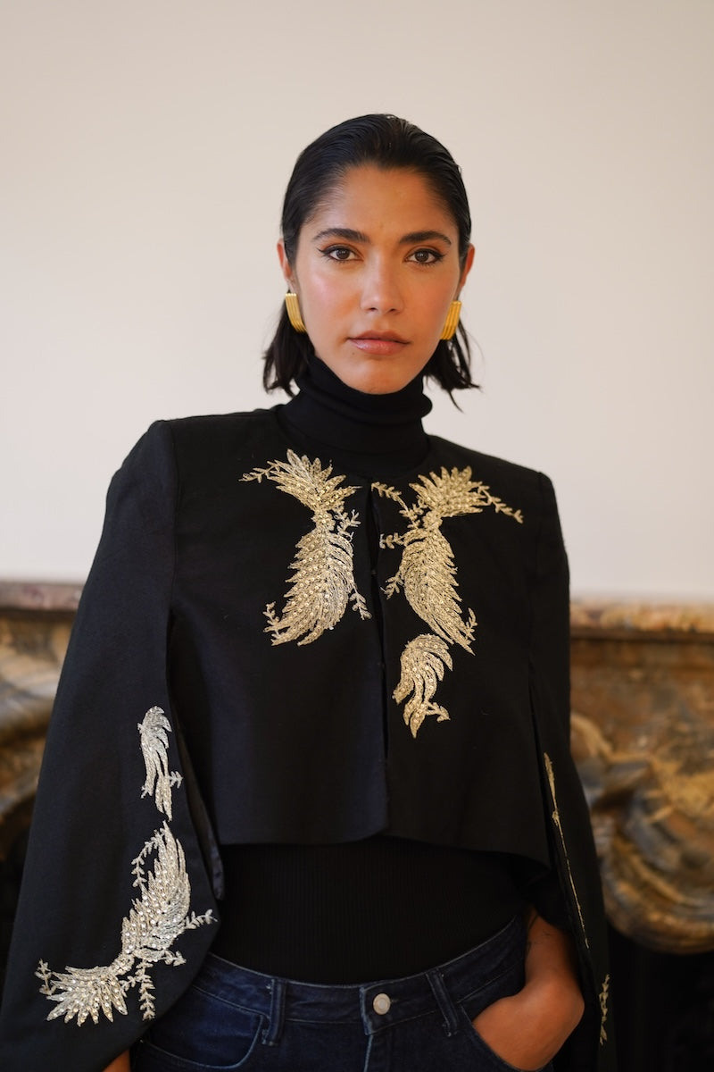 Nadya Shah Phoebe Cape jacket shown from the front, featuring a stylish, flowy design with a soft fabric and elegant drape.