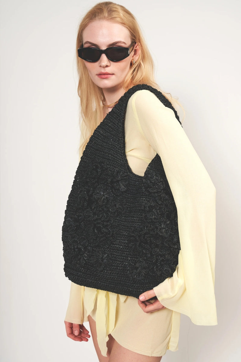 Black Pinet shoulder bag by Emm Kuo featuring a spacious design and sleek shoulder strap, perfect for everyday use.