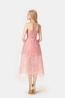 Pink beaded lace midi dress by Montsand featuring intricate lace detailing and a flowing silhouette.