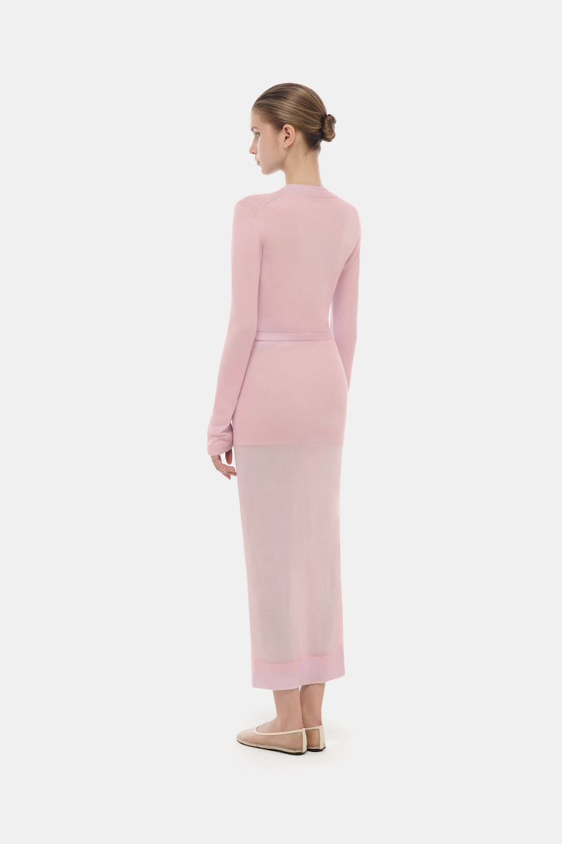 Pink button-up crop cardigan from Montsand, featuring a fitted design and long sleeves, perfect for layered tops.
