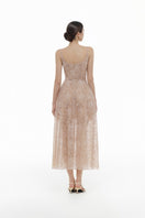 Pink lace gown with floral design by Montsand, featuring elegant embroidery and a flowing silhouette.