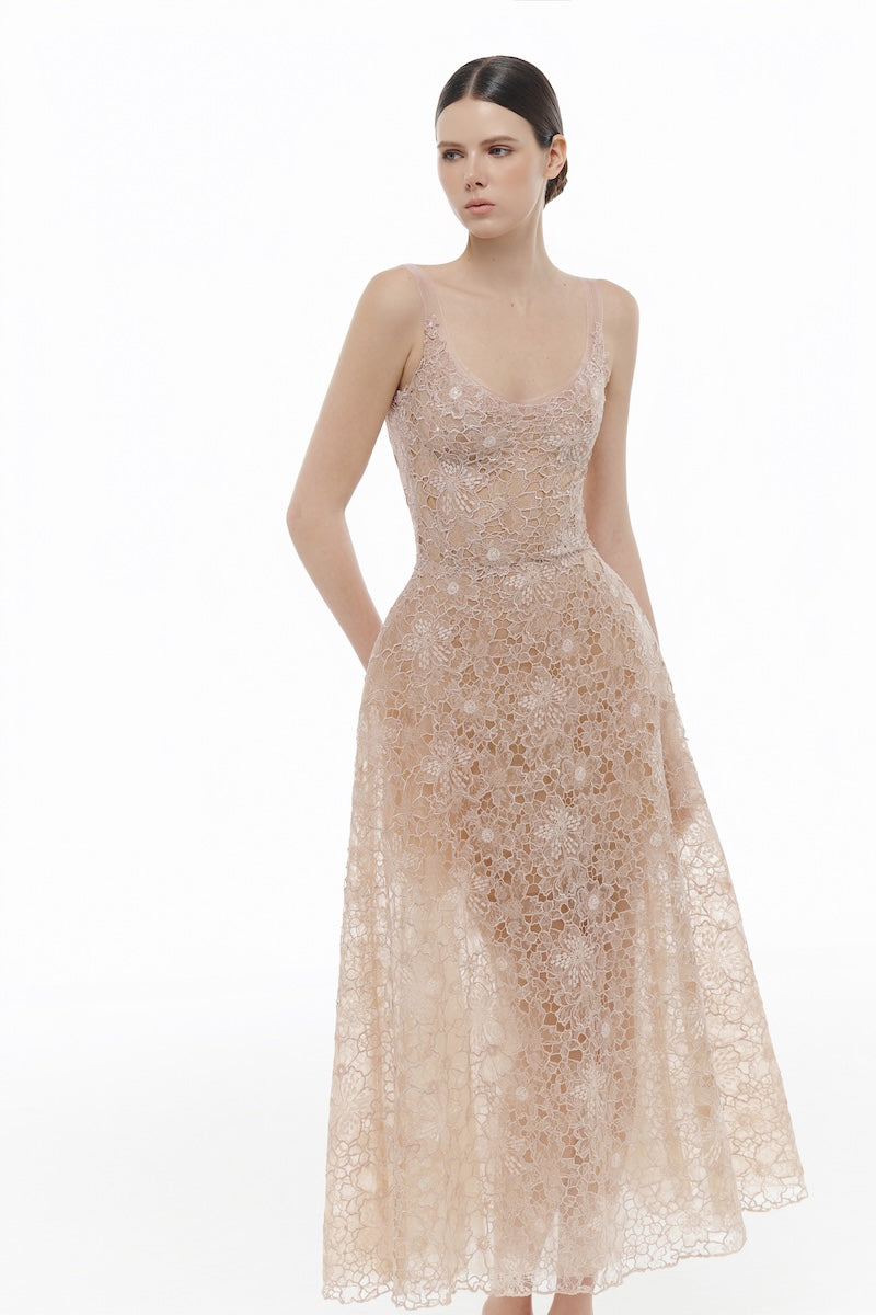 Pink lace gown with floral embroidery from Montsand, featuring a flowing design and delicate lace details.
