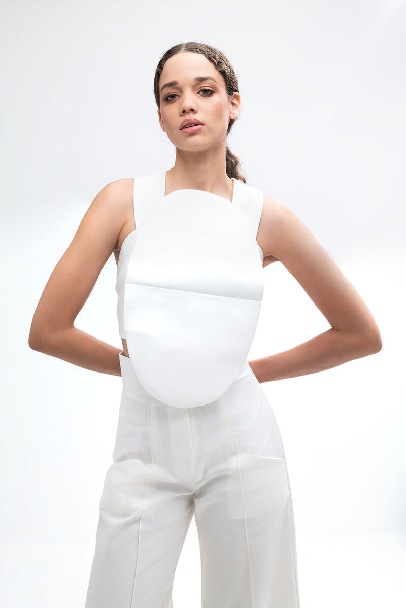 Light ivory Pino pants by ANA + MARIA featuring a relaxed fit and stylish design, shown on a model.