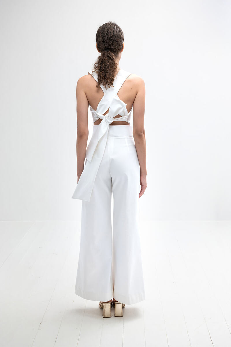 Light ivory Pino pants by ANA + MARIA displayed on a mannequin, showcasing their relaxed fit and stylish design.