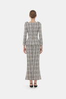 Montsand plaid tweed V-neck peplum blazer top displayed with a matching plaid tweed midi skirt.