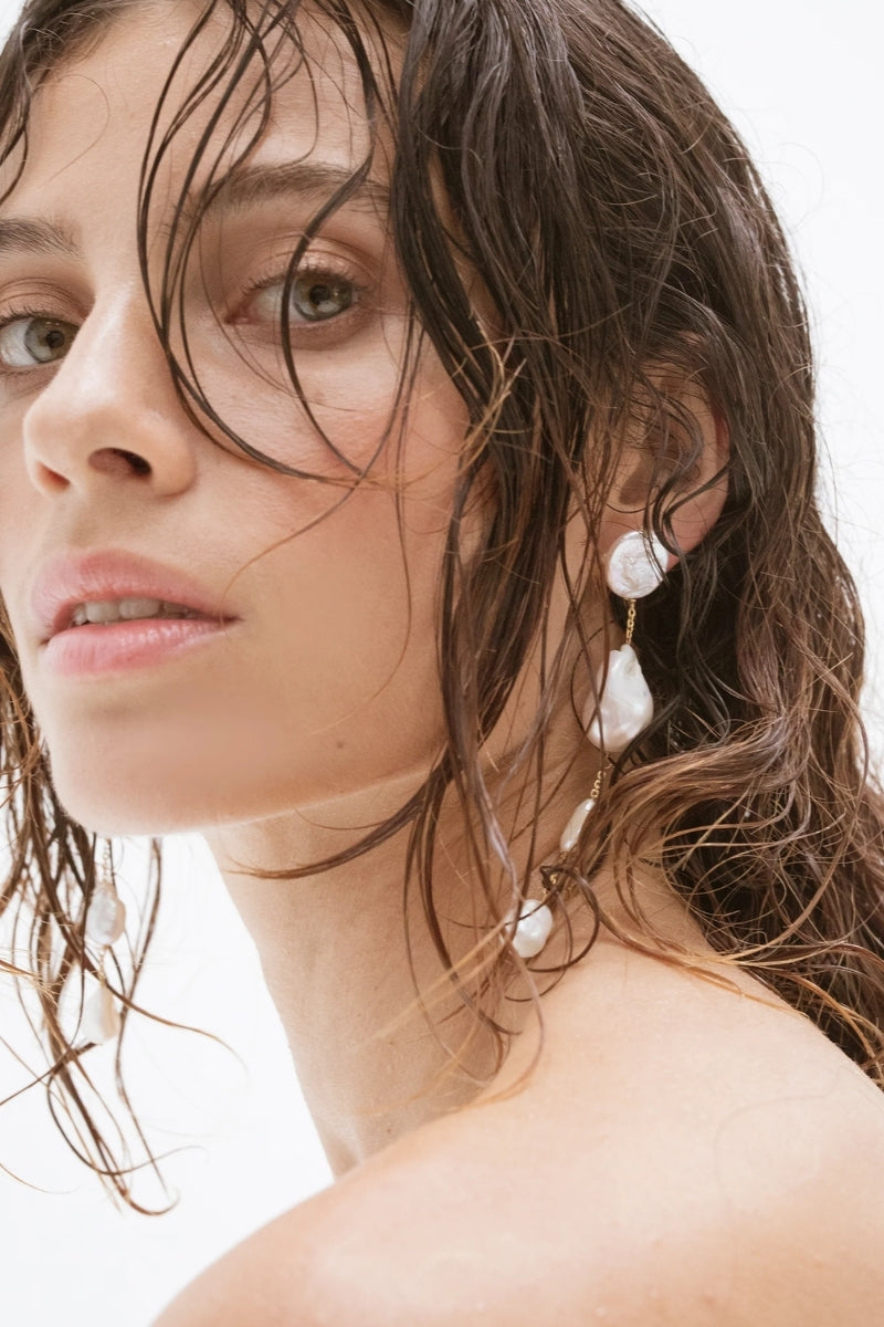 LAVANI JEWELS Pluie Pearl Earrings featuring elegant pearl drops and delicate metal hooks, perfect for sophisticated styles.