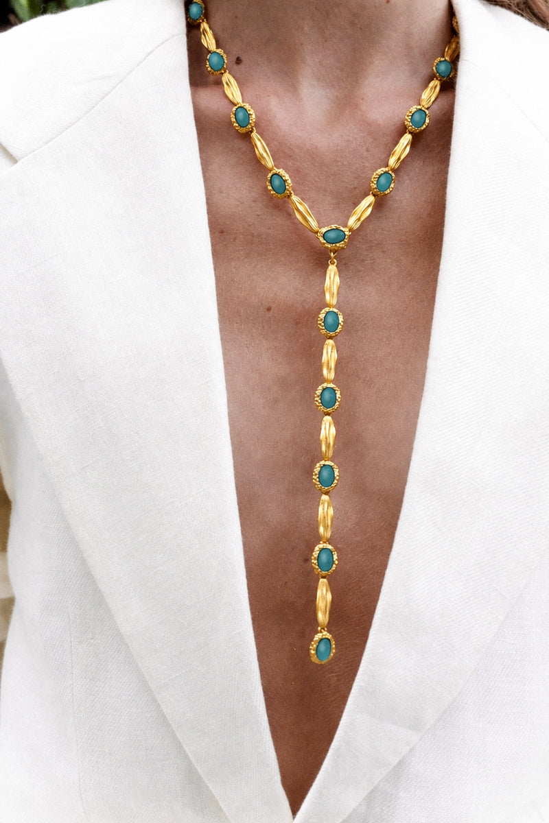 Gold and blue Jude Benhalim Poise Necklace featuring a delicate chain and elegant pendant design.