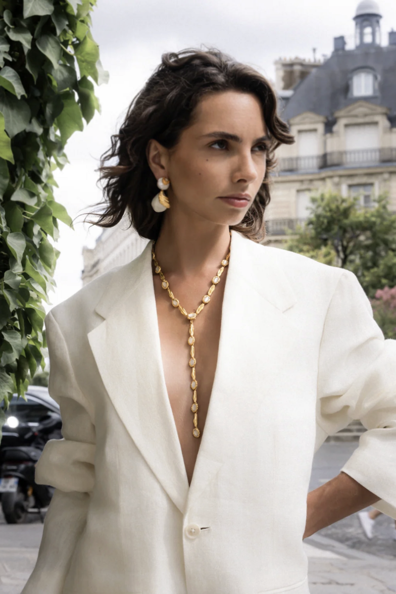 Gold and white Poise Necklace by Jude Benhalim featuring elegant layered chain design.