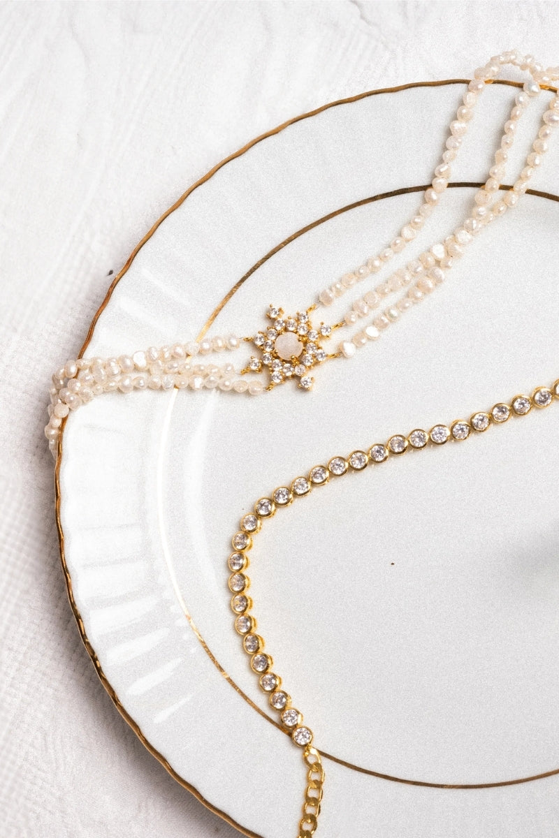 LAVANI JEWELS Polaris Pearl Choker necklace featuring a delicate string of pearls on a sleek, elegant chain.