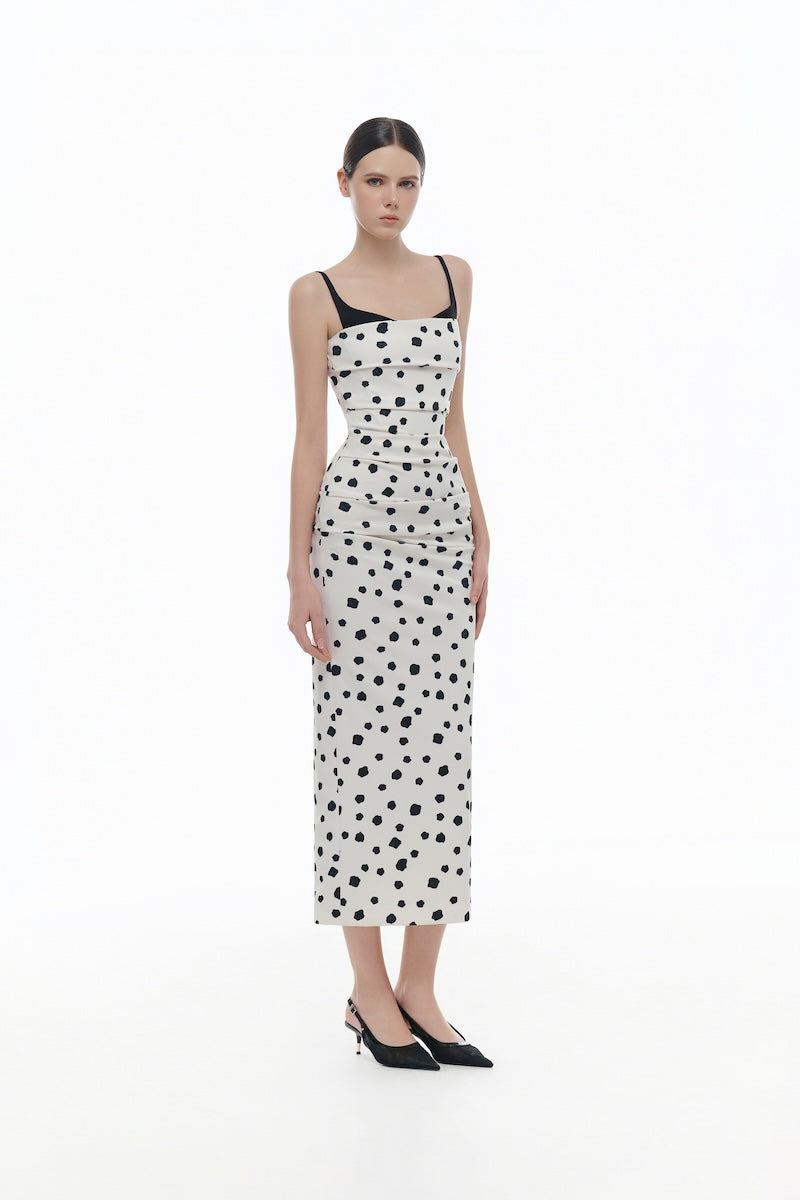 Montsand polka dot draped midi dress featuring a flowing silhouette and classic pattern, perfect for stylish occasions.