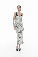 Montsand polka dot draped midi dress featuring a flowy silhouette and stylish design, perfect for elegant daytime wear.