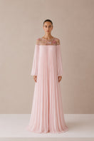 Light pink Pollen dress by Nihan Peker, elegant gown with flowy fabric and delicate design, shown on a model.