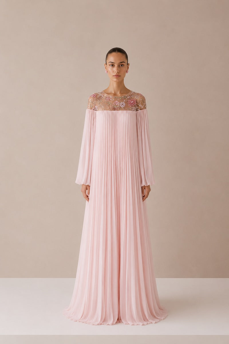 Light pink Pollen dress by Nihan Peker, elegant gown with flowy fabric and delicate design, shown on a model.
