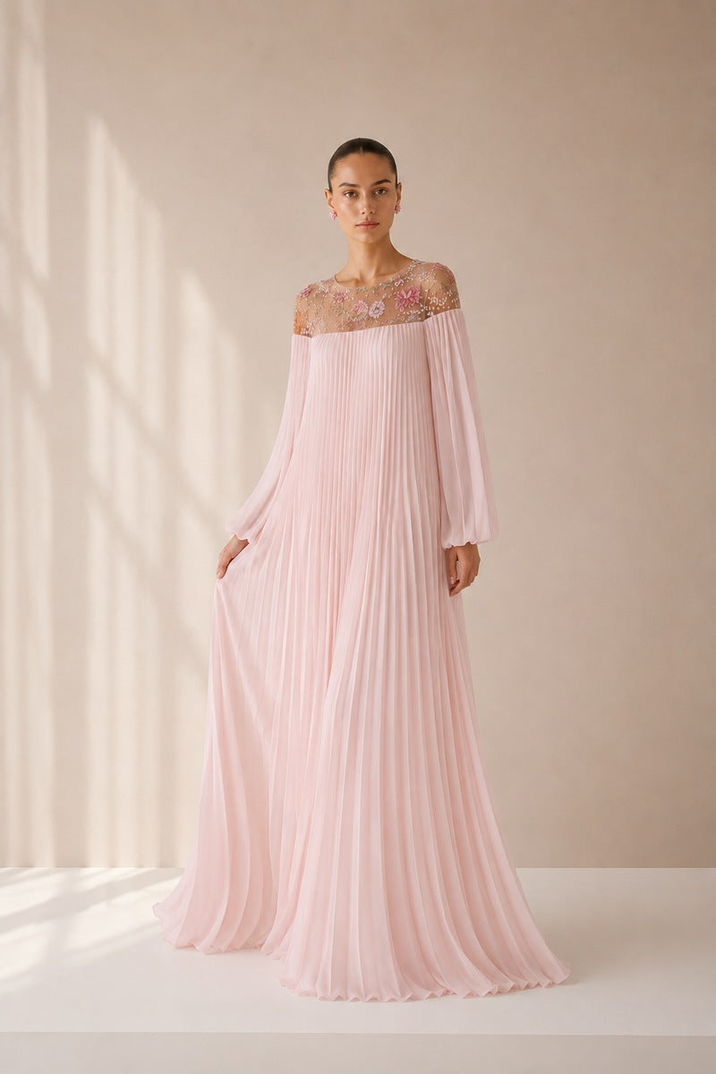 Light pink Pollen dress by Nihan Peker, elegant gown with flowing fabric and intricate detailing, displayed on a dress form.