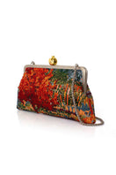 Multicolor pomegranate clutch bag on autumn field-inspired background, featuring vibrant design by Sarah's Bag.