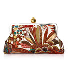 Brown clutch bag with a pomegranate and jungle motif by Sarah's Bag, featuring a compact, stylish design for evening or special occasions.