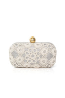 Silver Sarah's Bag clutch with a crochet pomegranate design on a sleek silver box-shaped purse.