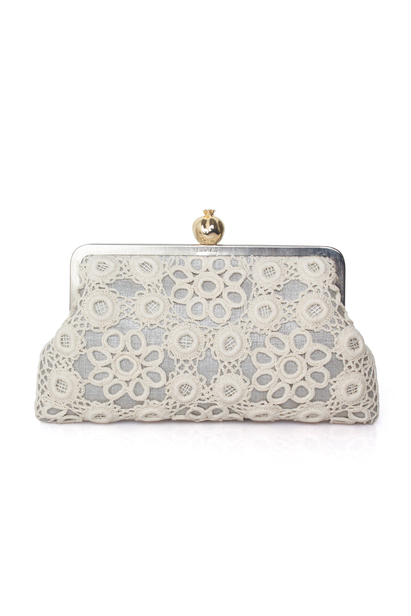Sarah's Bag silver clutch featuring a pomegranate design with crochet detailing, elegant and stylish for special occasions.